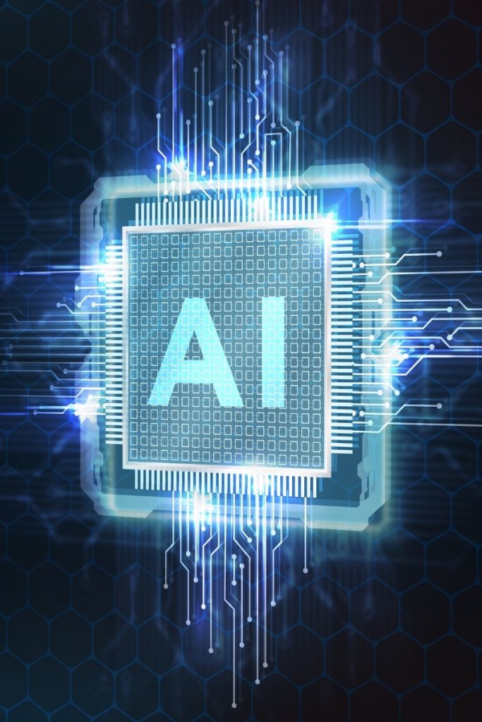 Computer chip with AI lettering and a glow
