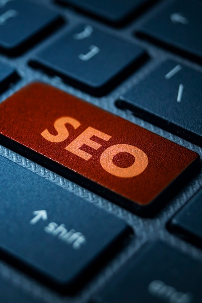 Orange SEO button standing out on a keyboard